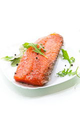 Wall Mural - piece of salty red fish with different seasonings and herbs in a plate