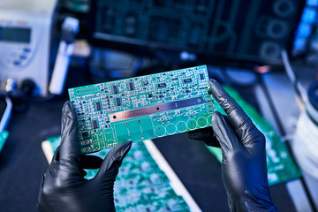 Sticker - Engineer factory worker electronics works with a chip (board). Microchip Production, Nano computer Technology and manufacturing technological process