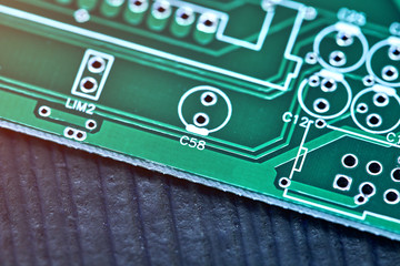 Wall Mural - Green system board with microchips and transistors. Microchip Production, Nano computer Technology and manufacturing technological process