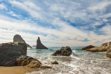 Wall Mural - Waves breaking on sea stacks along Bandon Beach in Oregon