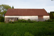 Barn in a green field