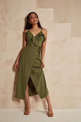 fashion model brunette hair wear green silk dress sandals high heels accessory bag clothes for date 