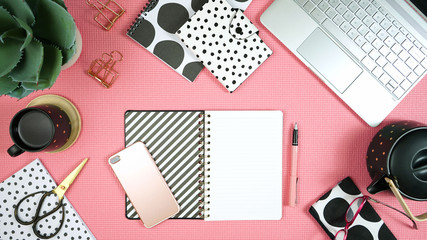 Wall Mural - Desktop workspace flat lay with hi-tech touch screen laptop and modern pink, black and white accessories on white background.