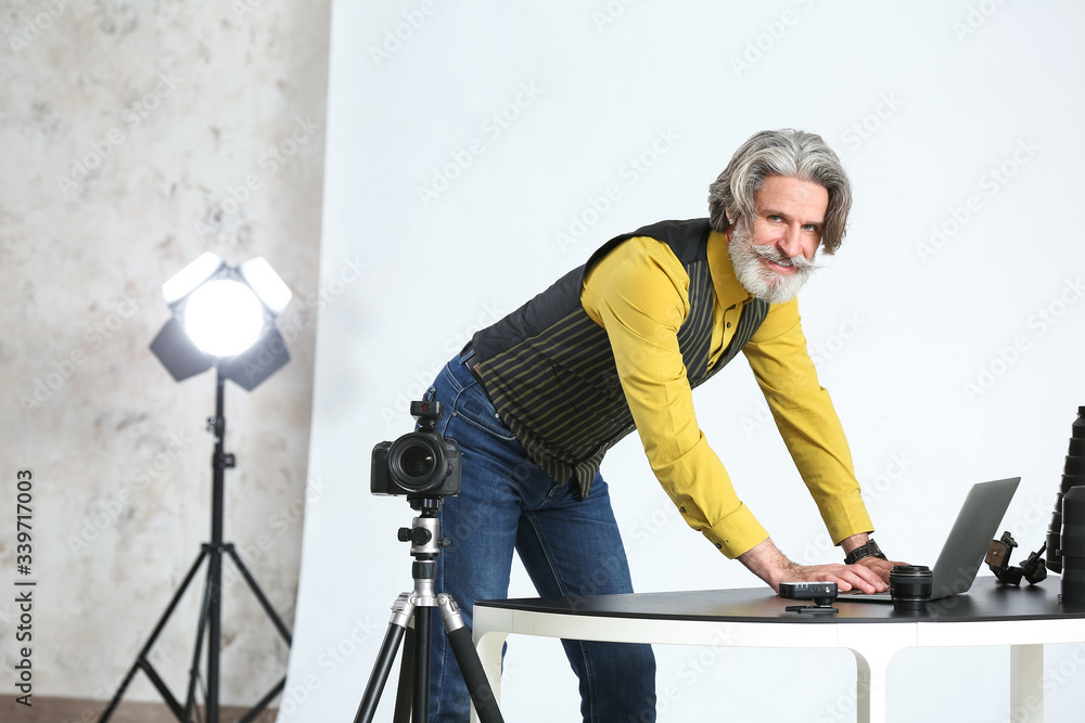 Senior photographer working in studio