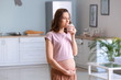 © Pixel-Shot - Beautiful pregnant woman with healthy yogurt at home