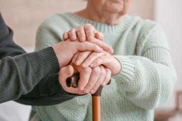 Wall Mural - Elderly people suffering from mental disability at home, closeup