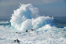 Huge Waves Crashing On Sea Against Sky