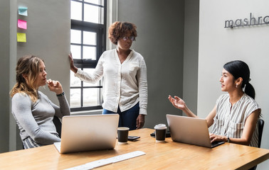 Wall Mural - Group of diverse women having a business meeting