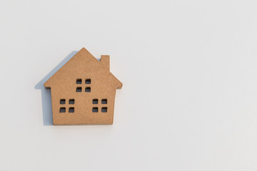 Wall Mural - Small wooden toy house on white background.