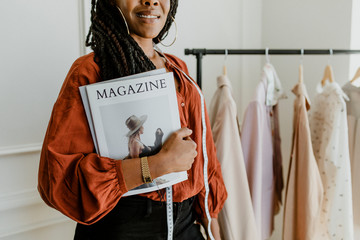 Wall Mural - Fashion designer holding a magazine