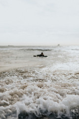 Canvas Print - Surfer floating on the surfboard