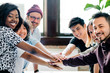 © rawpixel.com - Diverse startup business team stacking hands