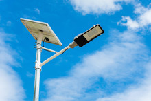 Street Light With Solar Panel Energy With Blue Sky Background
