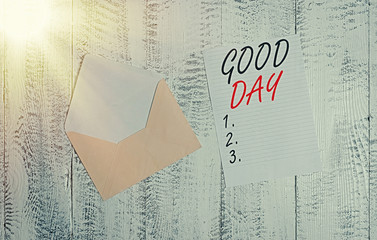 Wall Mural - Handwriting text Good Day. Conceptual photo Enjoying the moment with great weather Having lots of fun Front view open colored envelope blank sheet letter paper wooden background