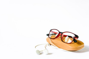 eyeglass placed on its wooden case