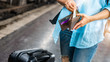 © Chan2545 - Young woman backpacker traveler hands holding wallet dollar currency money plan to saving spend budget for holiday buy cheap discount deals travel promotion trip after coronavirus empty tourist crisis