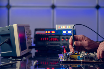 Sticker - Debugging electronics device. PCB witch microcontroller in electronics laboratory