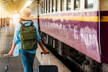 Solo Woman Backpacker Traveler Plan Safety Trip Low Cost Budget Summer Holiday After Coronavirus. Empty Tourists On Train Railway Platforms. Use Bus Train Sustainable Environmental Friendly Transport