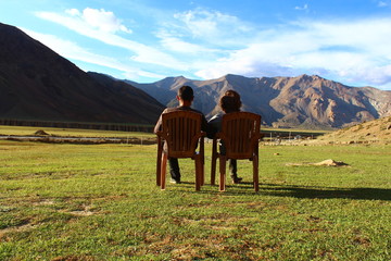 2 people enjoying a mountain view, Ladakh, Himalaya, India