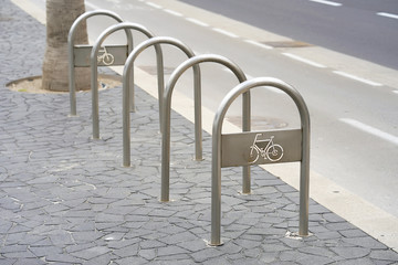 Empty bike parking. Parking space or spot for multiple bikes. place for Parking at the house or shop of bicycles or scooters, environmental transport in the city. Empty parking in city park.