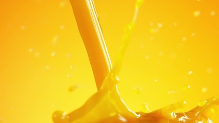 Fototapete - Super slow motion of pouring orange juice isolated on coloured background. Filmed on high speed cinema camera, 1000 fps.