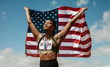© Jacob Lund - Proud female athlete with USA flag