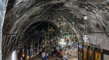 Many lamps hang under the ceiling in the Tomb of the Virgin on foot of the mountain Mount Eleon - Mount of Olives in East Jerusalem in Israel