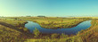 © valeriy boyarskiy - Sunny panoramic view of blue river and green meadows with trees on background.Retro and vintage colors.