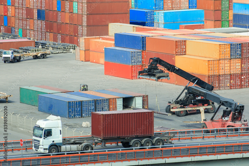 Container Export Import Loading Forklifts loads containers at container terminal. Logistics import ...