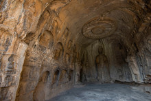 Buddha Sculpture In Cave Interior Of Luoyang Longmen Grottoes, Henan, China