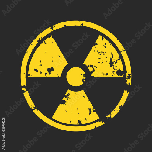 Fotografía Vector illustration of grunge yellow radioactive hazard warning sign painted over black background
