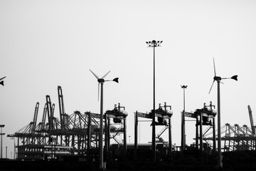 Chon buri, Thailand - 31 March 2020. Wind turbines provide electric power. In the electricity generation industry of Thailand. Industrial silhouette.