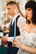 © olegparylyak - Bride and groom holding candles in church