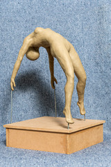 Gypsum sculpture of an unknown girl. The girl makes a gymnastic figure. Naked Girl Sculpture