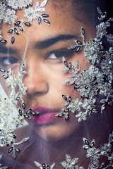 Wall Mural - portrait of beauty young afro woman through white lace, like new bride under veil close up