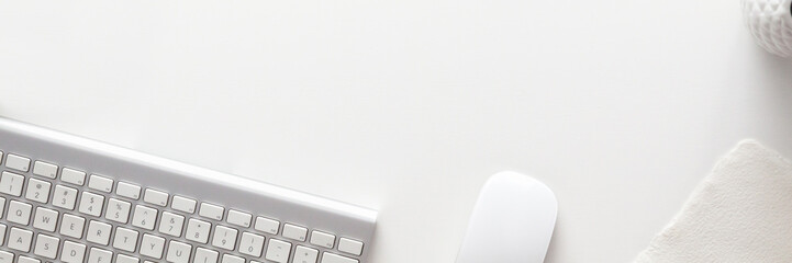 White on white. Office desk with empty copy space. Office supplies. Panorama