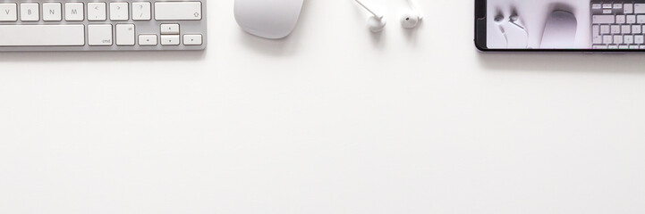 White on white. Office desk with empty copy space. Office supplies. Geometry. Panorama