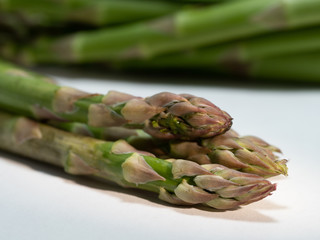 green asparagus on white background