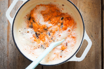 Wall Mural - Carrot cake batter with beaten eggs, grated carrots & raisins