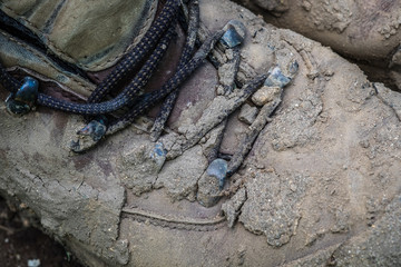 Wall Mural - Close up of muddy work boots