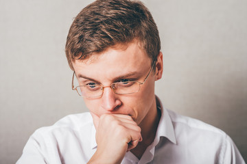 thinking guy in eyeglasses