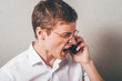 An angry businessman over the phone.