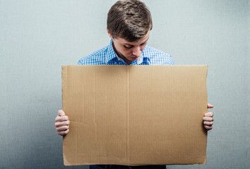 man holding cardboard