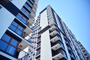 Modern apartment buildings on a sunny day with a blue sky. Facade of a modern apartment building