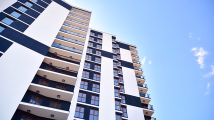 Modern apartment buildings on a sunny day with a blue sky. Facade of a modern apartment building