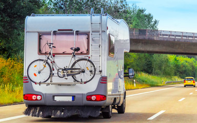 Sticker - Caravan with bicycle on driveway in Switzerland reflex