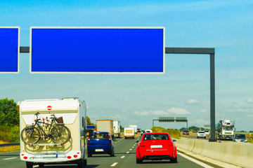 Canvas Print - Caravan with bicycles and cars on road in Switzerland reflex