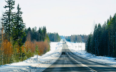 Wall Mural - Landscape with car in road snowy winter Lapland reflex