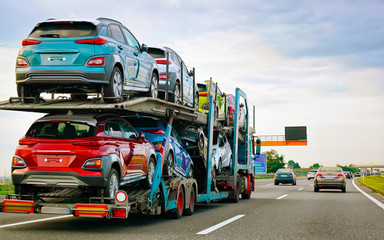 Wall Mural - Cars carrier truck at asphalt highway road in Poland reflex