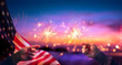 canvas print picture Usa Celebration - Hands Holding Sparklers And American Flag At Sunset With Fireworks
